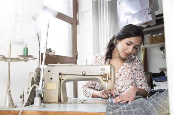 Image of a Girl Stitching with Tailoring Machine